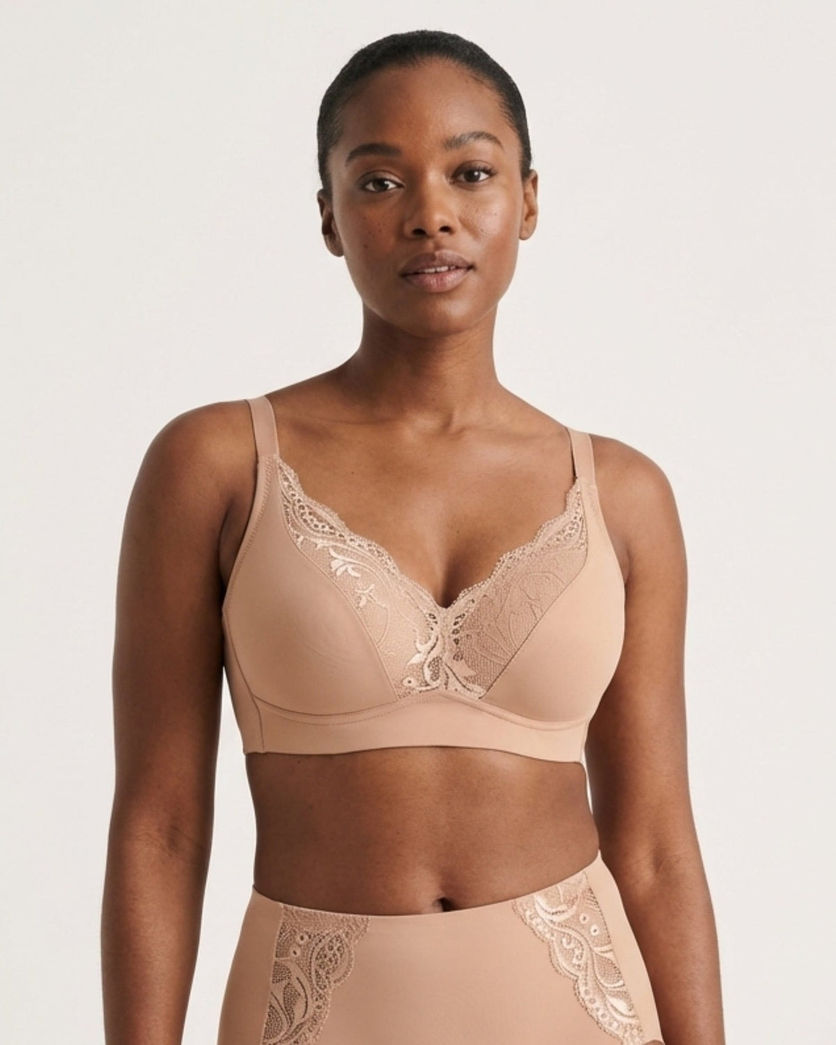A model wearing a Molded Cup Bra w/ lace, photographed against a clean light gray studio background.