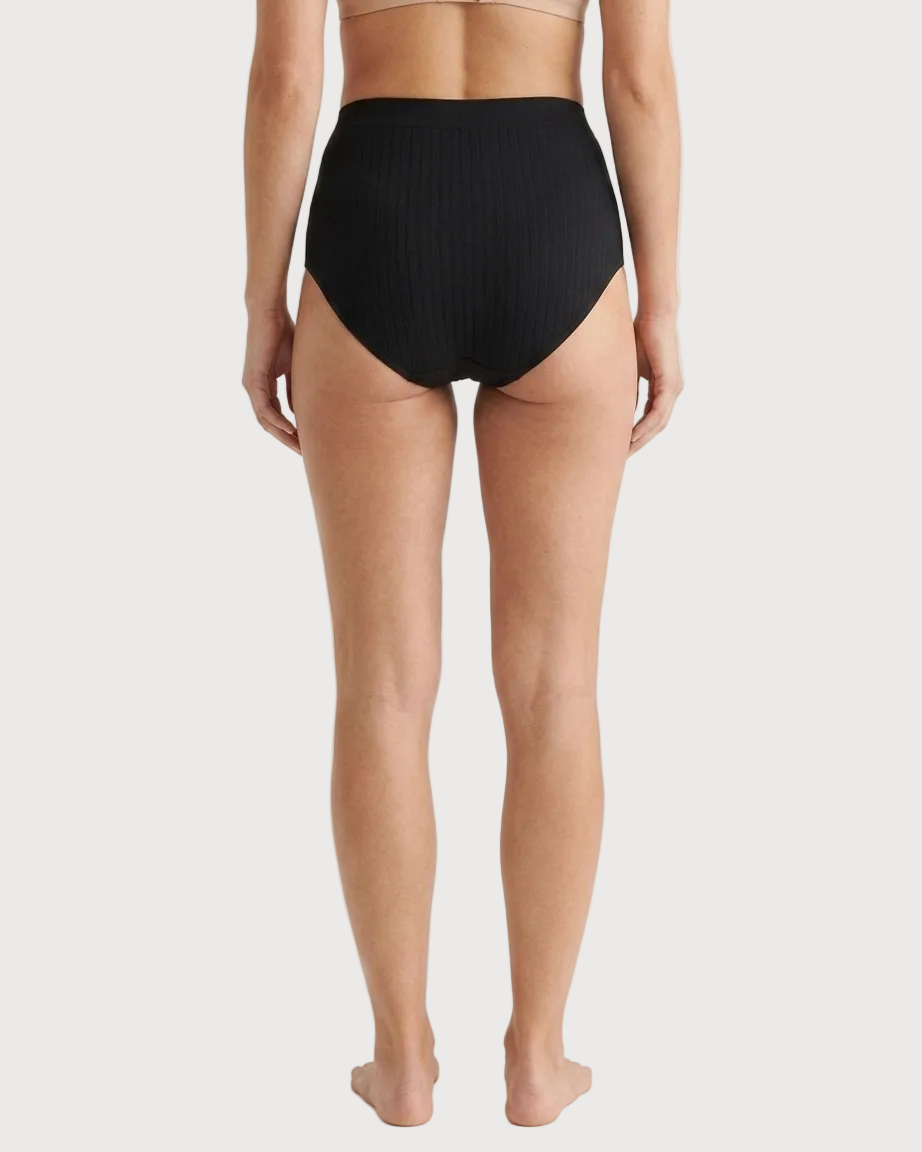 Ribbed Seamless Leakproof Brief shown on a model from the back against a plain light background.