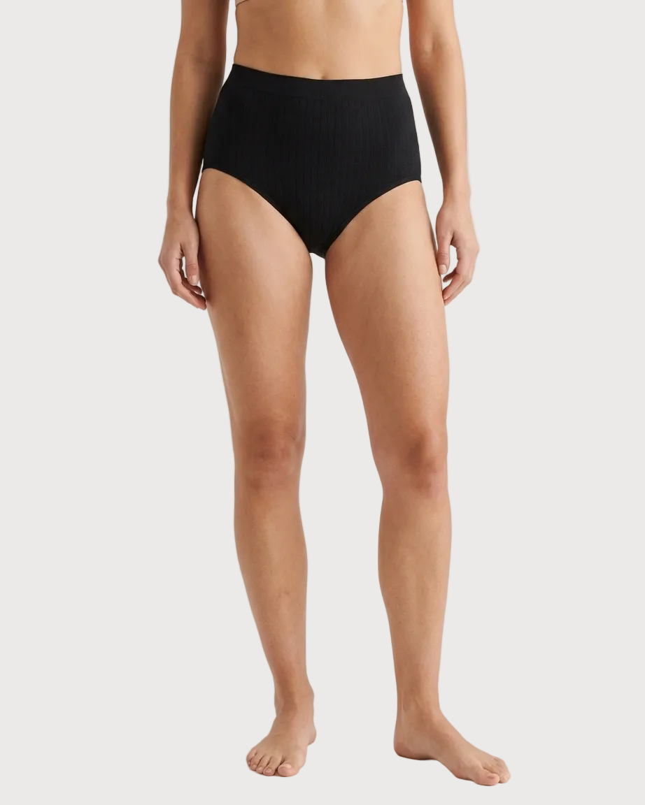 A model wearing black Seamless Leakproof Brief, shown from the waist down against a plain light background.
